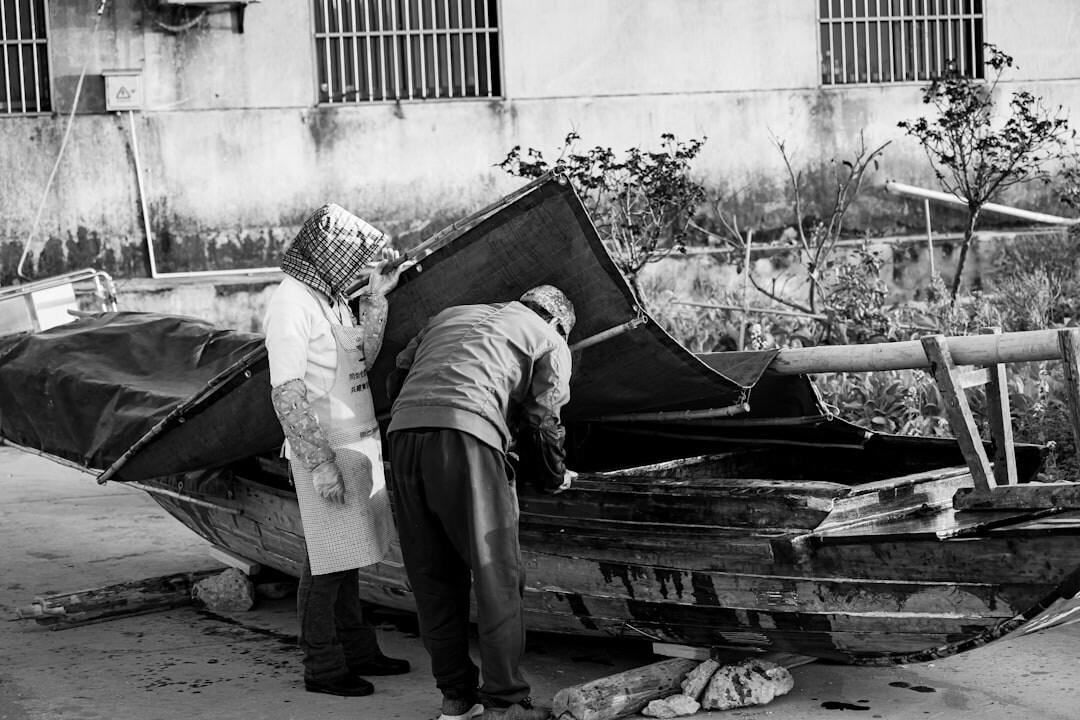 men restoring boats
