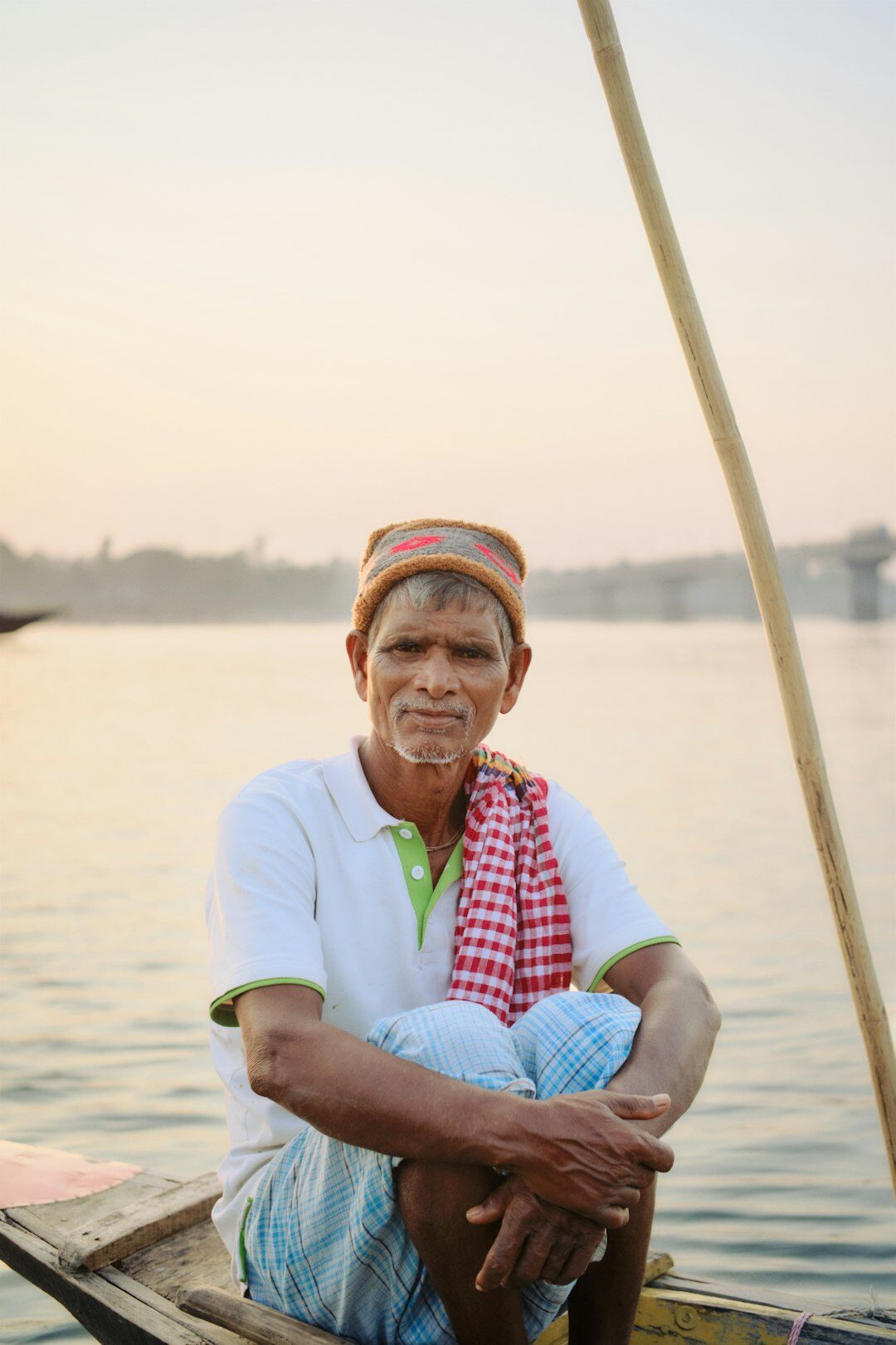 elderly fisherman by boat